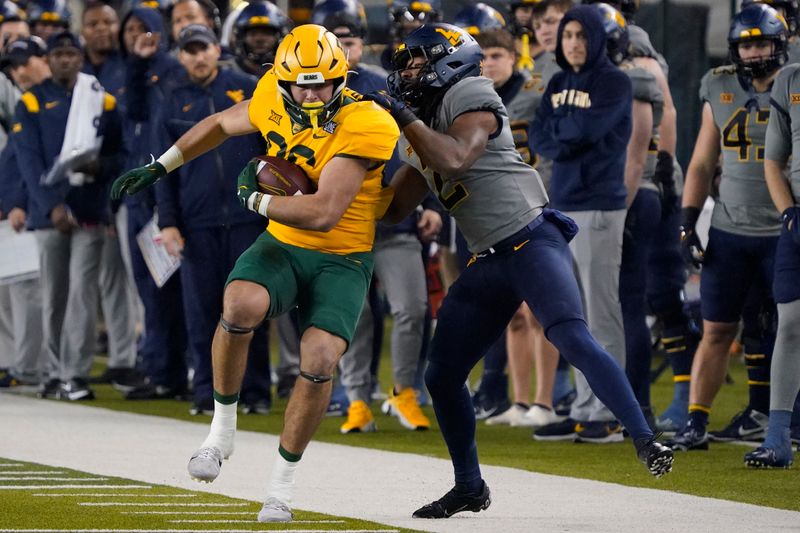 Nov 25, 2023; Waco, Texas, USA; Baylor Bears tight end Jake Roberts (86) is tackled by West Virginia Mountaineers safety Aubrey Burks (2) during the first half at McLane Stadium. Mandatory Credit: Raymond Carlin III-USA TODAY Sports