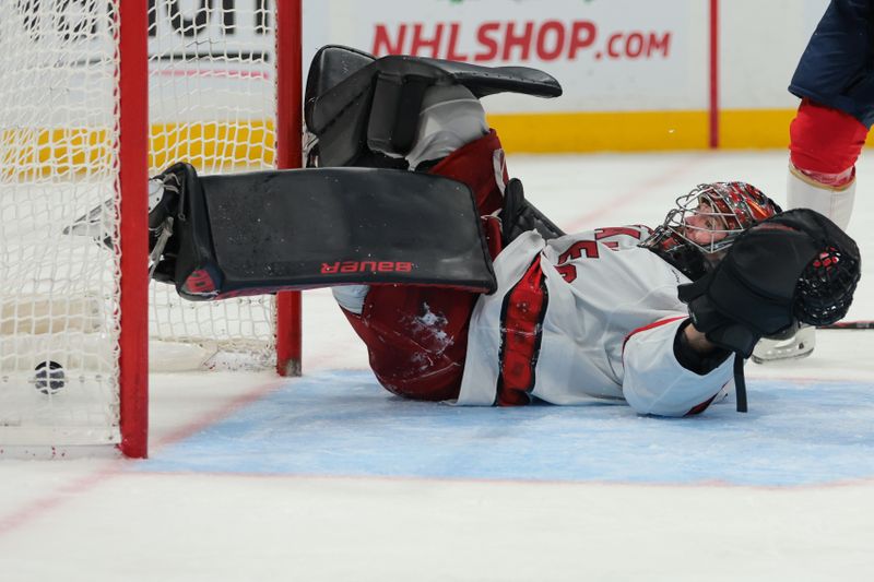 Nov 30, 2024; Sunrise, Florida, USA; Carolina Hurricanes goaltender Spencer Martin (41) gets scored on by Florida Panthers defenseman Aaron Ekblad (not pictured) during the second period at Amerant Bank Arena. Mandatory Credit: Sam Navarro-Imagn Images