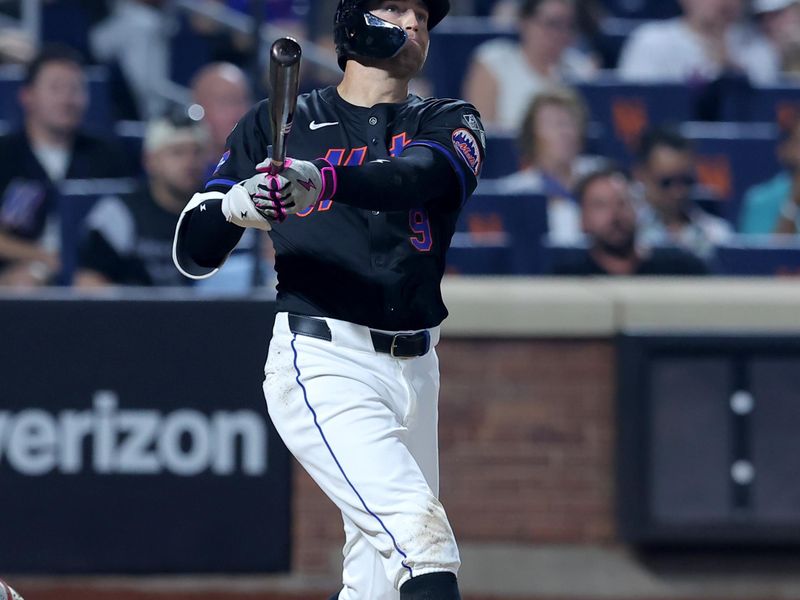 Aug 16, 2024; New York City, New York, USA; New York Mets left fielder Brandon Nimmo (9) follows through on a three run home run against the Miami Marlins during the fourth inning at Citi Field. Mandatory Credit: Brad Penner-USA TODAY Sports