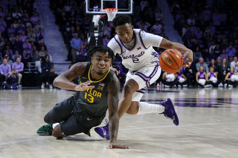 Jan 16, 2024; Manhattan, Kansas, USA; Kansas State Wildcats guard Tylor Perry (2) steals th ball from Baylor Bears guard Langston Love (13) during overtime at Bramlage Coliseum. Mandatory Credit: Scott Sewell-USA TODAY Sports