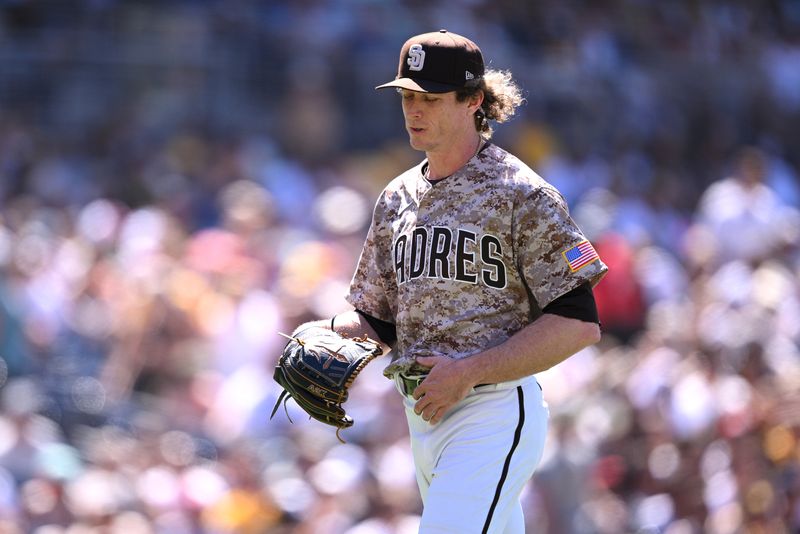 Jun 25, 2023; San Diego, California, USA; San Diego Padres relief pitcher Tim Hill (25) walks to the dugout during a pitching change in the seventh inning against the Washington Nationals at Petco Park. Mandatory Credit: Orlando Ramirez-USA TODAY Sports