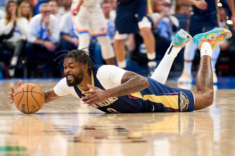 OKLAHOMA CITY, OKLAHOMA - APRIL 21: Naji Marshall #8 of the New Orleans Pelicans dives for a loose ball against the Oklahoma City Thunder in game one of the Western Conference First Round Playoffs at the Paycom Center on April 21, 2024 in Oklahoma City, Oklahoma. NOTE TO USER: User expressly acknowledges and agrees that, by downloading and or using this photograph, User is consenting to the terms and conditions of the Getty Images License Agreement.  (Photo by Cooper Neill/Getty Images)