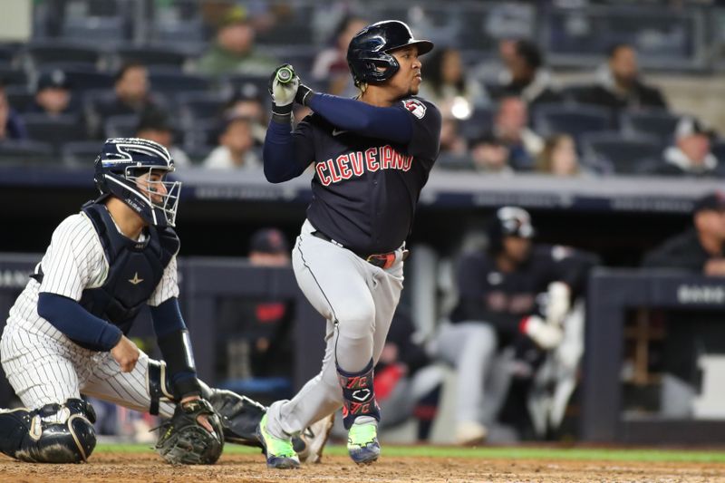 May 1, 2023; Bronx, New York, USA;  Cleveland Guardians third baseman Jose Ramirez (11) hits a single in the ninth inning against the New York Yankees at Yankee Stadium. Mandatory Credit: Wendell Cruz-USA TODAY Sports