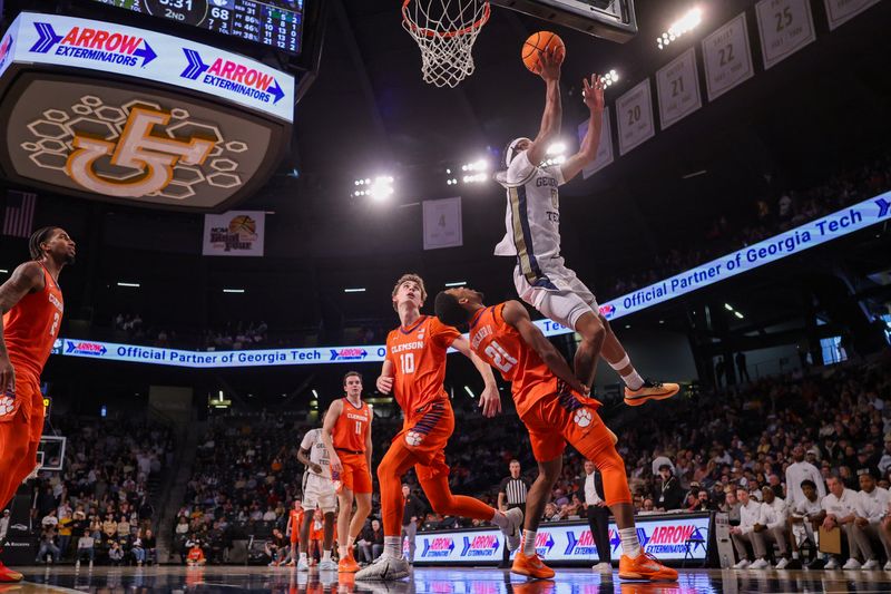 Jan 24, 2026; Atlanta, Georgia, USA; Georgia Tech Yellow Jackets guard Akai Fleming (0) shoots over Clemson Tigers guard Ace Buckner (21) in the second half at McCamish Pavilion. Mandatory Credit: Brett Davis-Imagn Images
