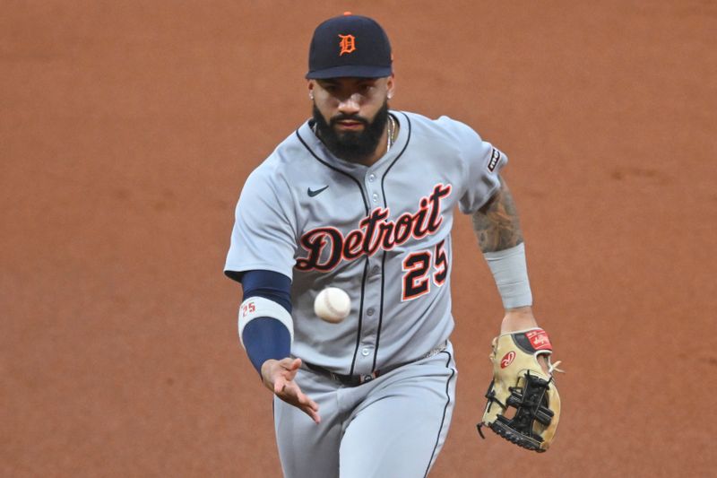 Sep 25, 2025; Cleveland, Ohio, USA; Detroit Tigers second baseman Gleyber Torres (25) tosses the ball to first base in the second inning against the Cleveland Guardians at Progressive Field. Mandatory Credit: David Richard-Imagn Images
