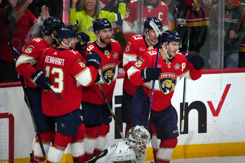 Jan 11, 2024; Sunrise, Florida, USA; Florida Panthers left wing Matthew Tkachuk (19) celebrates his goal against the Los Angeles Kings with teammates on the ice during the third period at Amerant Bank Arena. Mandatory Credit: Jasen Vinlove-USA TODAY Sports