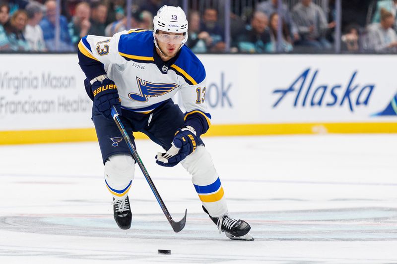 Oct 8, 2024; Seattle, Washington, USA; St. Louis Blues right wing Alexey Toropchenko (13) skates with the puck against the Seattle Kraken during the second period at Climate Pledge Arena. Mandatory Credit: Caean Couto-Imagn Images