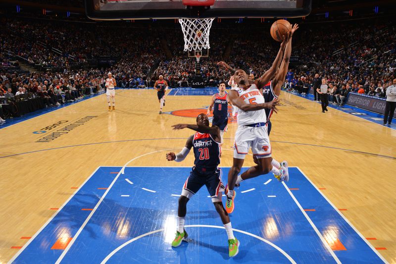 NEW YORK, NY - APRIL 2: Immanuel Quickley #5 of the New York Knicks drives to the basket during the game against the Washington Wizards on April 2, 2023 at Madison Square Garden in New York City, New York NOTE TO USER: User expressly acknowledges and agrees that, by downloading and/or using this Photograph, user is consenting to the terms and conditions of the Getty Images License Agreement. Mandatory Copyright Notice: Copyright 2023 NBAE (Photo by Jesse D. Garrabrant/NBAE via Getty Images)