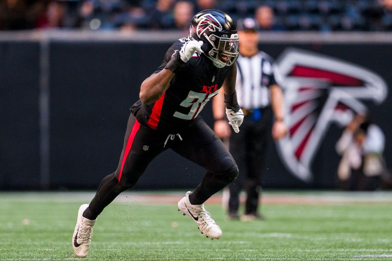 Atlanta Falcons defensive end Zach Harrison (96) works during the first half of an NFL football game against the Houston Texans, Sunday, Oct. 8, 2023, in Atlanta. The Atlanta Falcons won 21-19. (AP Photo/Danny Karnik)