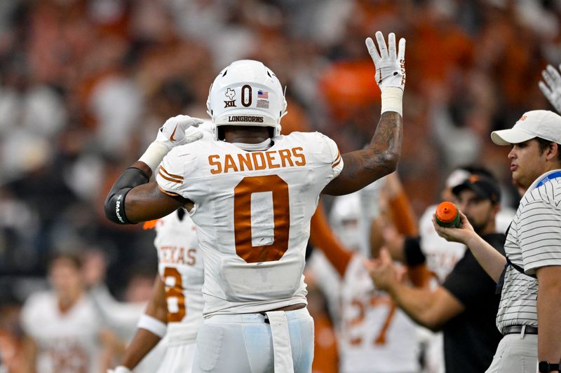 Dec 2, 2023; Arlington, TX, USA;  Texas Longhorns tight end Ja'Tavion Sanders (0) celebrates during the second half against the Oklahoma State Cowboys at AT&T Stadium. Mandatory Credit: Jerome Miron-USA TODAY Sports