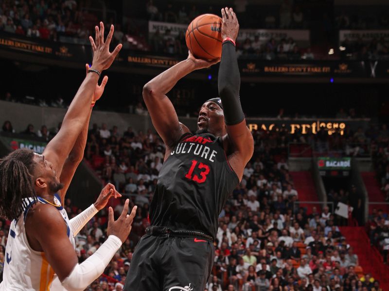 MIAMI, FL - MARCH 26: Bam Adebayo #13 of the Miami Heat shoots the ball during the game against the Golden State Warriors  on March 26, 2024 at Kaseya Center in Miami, Florida. NOTE TO USER: User expressly acknowledges and agrees that, by downloading and or using this Photograph, user is consenting to the terms and conditions of the Getty Images License Agreement. Mandatory Copyright Notice: Copyright 2024 NBAE (Photo by Issac Baldizon/NBAE via Getty Images)