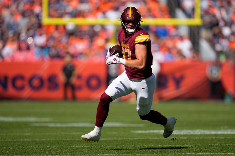 Washington Commanders tight end John Bates (87) runs against the Denver Broncos during an NFL football game Sunday, Sept. 10, 2023, in Denver. (AP Photo/Jack Dempsey)