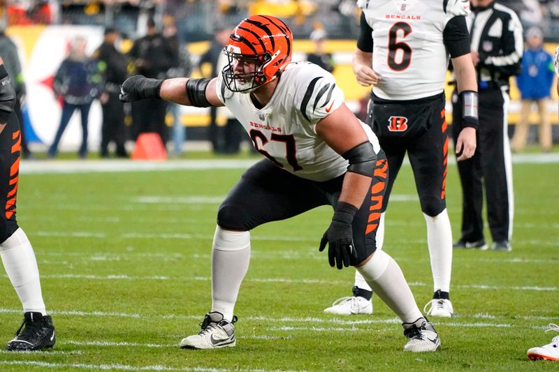 Cincinnati Bengals guard Cordell Volson (67) lines up for a snap during the first half of an NFL football game against the Pittsburgh Steelers in Pittsburgh, Saturday, Dec. 23, 2023. (AP Photo/Gene J. Puskar)