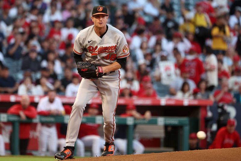 Sep 6, 2023; Anaheim, California, USA; Baltimore Orioles starting pitcher Kyle Gibson (48) watches a ball hit by Los Angeles Angels third baseman Mike Moustakas (not pictured) for a double-play during the first inning at Angel Stadium. Mandatory Credit: Kiyoshi Mio-USA TODAY Sports