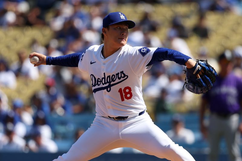 Sep 22, 2024; Los Angeles, California, USA;  Los Angeles Dodgers starting pitcher Yoshinobu Yamamoto (18) pitches during the first inning against the Colorado Rockies at Dodger Stadium. Mandatory Credit: Kiyoshi Mio-Imagn Images