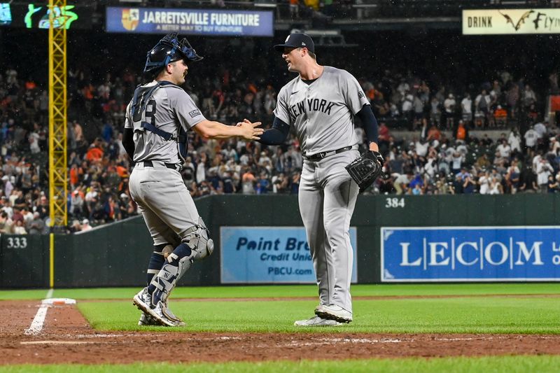 Jul 12, 2024; Baltimore, Maryland, USA; New York Yankees pitcher Clay Holmes (35) celebrates withcatcher Jose Trevino (39) after the game against the Baltimore Orioles  at Oriole Park at Camden Yards. Mandatory Credit: Tommy Gilligan-USA TODAY Sports