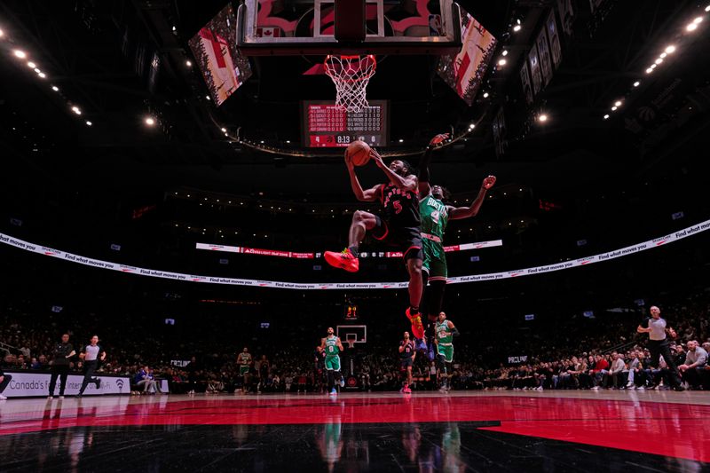 TORONTO, CANADA - JANUARY 15:  Toronto Raptors #5 Immanuel Quickley drives to the basket during the game against the Boston Celticson January 15, 2024 at the Scotiabank Arena in Toronto, Ontario, Canada.  NOTE TO USER: User expressly acknowledges and agrees that, by downloading and or using this Photograph, user is consenting to the terms and conditions of the Getty Images License Agreement.  Mandatory Copyright Notice: Copyright 2024 NBAE (Photo by Mark Blinch/NBAE via Getty Images)