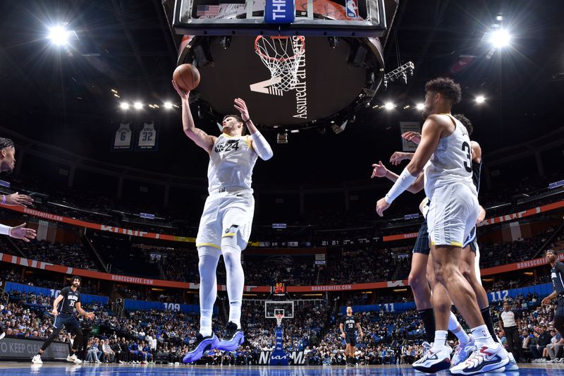 ORLANDO, FL - JANUARY 5 :  Walker Kessler #24 of the Utah Jazz goes up for the rebound during the game against the Orlando Magic on January 5, 2025 at Kia Center in Orlando, Florida. NOTE TO USER: User expressly acknowledges and agrees that, by downloading and or using this photograph, User is consenting to the terms and conditions of the Getty Images License Agreement. Mandatory Copyright Notice: Copyright 2025 NBAE (Photo by Fernando Medina/NBAE via Getty Images)