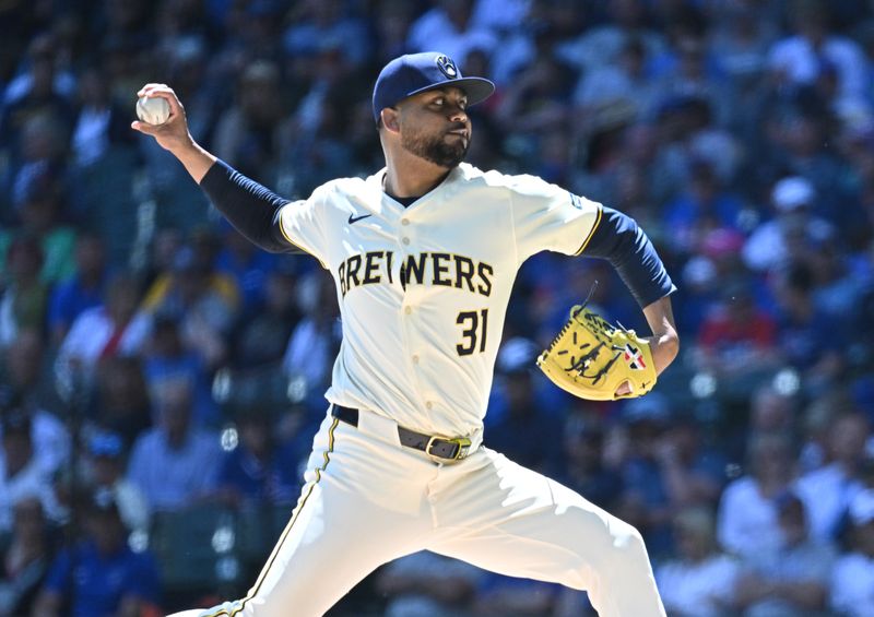 May 30, 2024; Milwaukee, Wisconsin, USA; Milwaukee Brewers relief pitcher Joel Payamps (31) delivers a pitch against the Chicago Cubs in the sixth inning at American Family Field. Mandatory Credit: Michael McLoone-USA TODAY Sports