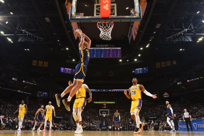 SAN FRANCISCO, CA - FEBRUARY 22:  Trayce Jackson-Davis #32 of the Golden State Warriors  goes to the basket during the game on February 22, 2024 at Chase Center in San Francisco, California. NOTE TO USER: User expressly acknowledges and agrees that, by downloading and or using this photograph, user is consenting to the terms and conditions of Getty Images License Agreement. Mandatory Copyright Notice: Copyright 2024 NBAE (Photo by Noah Graham/NBAE via Getty Images)