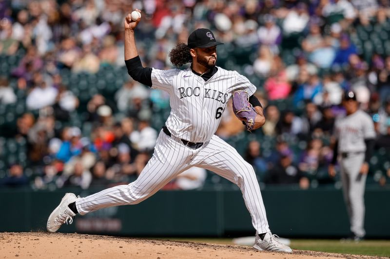 Apr 10, 2024; Denver, Colorado, USA; Colorado Rockies relief pitcher Justin Lawrence (61) pitches in the ninth inning against the Arizona Diamondbacks at Coors Field. Mandatory Credit: Isaiah J. Downing-USA TODAY Sports