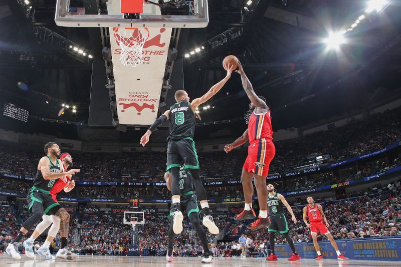 NEW ORLEANS, LA - MARCH 30: Kristaps Porzingis #8 of the Boston Celtics block during the game against the New Orleans Pelicans on March 30, 2024 at the Smoothie King Center in New Orleans, Louisiana. NOTE TO USER: User expressly acknowledges and agrees that, by downloading and or using this Photograph, user is consenting to the terms and conditions of the Getty Images License Agreement. Mandatory Copyright Notice: Copyright 2024 NBAE (Photo by Layne Murdoch Jr./NBAE via Getty Images)