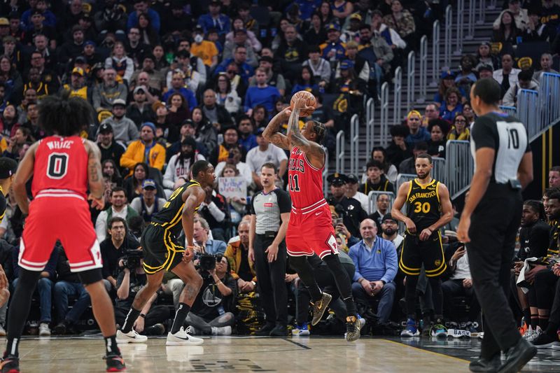 SAN FRANCISCO, CA - MARCH 7: DeMar DeRozan #11 of the Chicago Bulls goes up for a three-point jump shot against Jonathan Kuminga #00 of the Golden State Warriors in the first quarter at Chase Center on March 7, 2024 in San Francisco, California. NOTE TO USER: User expressly acknowledges and agrees that, by downloading and/or using this photograph, User is consenting to the terms and conditions of the Getty Images License Agreement. (Photo by Kavin Mistry/Getty Images)