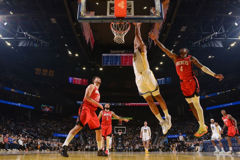 SAN FRANCISCO, CA - DECEMBER 5: Trayce Jackson-Davis #32 of the Golden State Warriors dunks the ball during the game against the Houston Rockets on December 5, 2024 at Chase Center in San Francisco, California. NOTE TO USER: User expressly acknowledges and agrees that, by downloading and or using this photograph, user is consenting to the terms and conditions of Getty Images License Agreement. Mandatory Copyright Notice: Copyright 2024 NBAE (Photo by Noah Graham/NBAE via Getty Images)