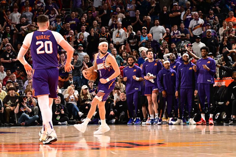 PHOENIX, AZ - APRIL 7: Devin Booker #1 of the Phoenix Suns smiles during the game against the New Orleans Pelicans on April 7, 2024 at Footprint Center in Phoenix, Arizona. NOTE TO USER: User expressly acknowledges and agrees that, by downloading and or using this photograph, user is consenting to the terms and conditions of the Getty Images License Agreement. Mandatory Copyright Notice: Copyright 2024 NBAE (Photo by Kate Frese/NBAE via Getty Images)