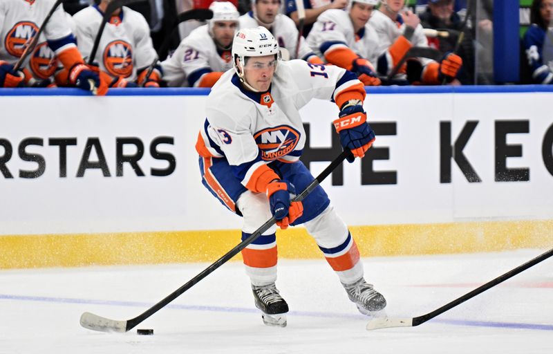 Feb 5, 2024; Toronto, Ontario, CAN;   New York Islanders forward Mathew Barzal (13) passes the puck against the Toronto Maple Leafs in the first period at Scotiabank Arena. Mandatory Credit: Dan Hamilton-USA TODAY Sports