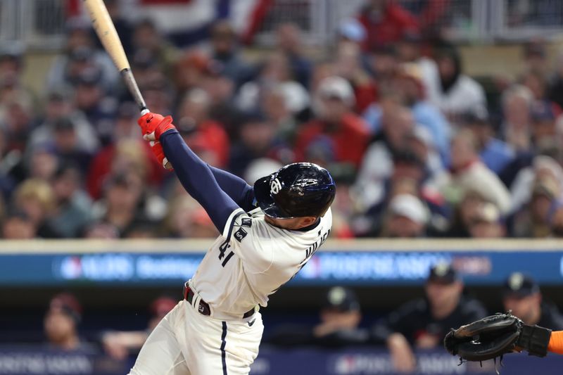 Oct 11, 2023; Minneapolis, Minnesota, USA; Minnesota Twins second baseman Edouard Julien (47) hits a solo home-run in the sixth inning against the Houston Astros during game four of the ALDS for the 2023 MLB playoffs at Target Field. Mandatory Credit: Jesse Johnson-USA TODAY Sports