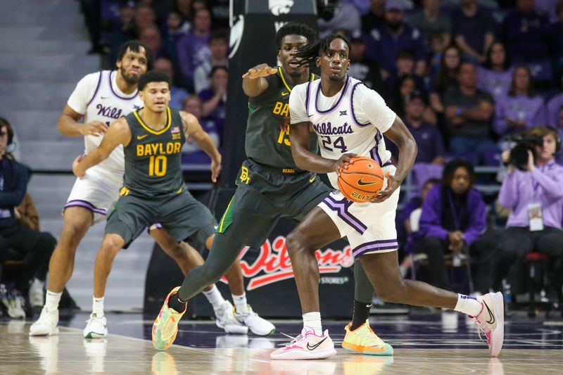 Jan 16, 2024; Manhattan, Kansas, USA; Kansas State Wildcats forward Arthur Maluma (24) is guarded by Baylor Bears forward Josh Ojinwuna (15) during the second half at Bramlage Coliseum. Mandatory Credit: Scott Sewell-USA TODAY Sports