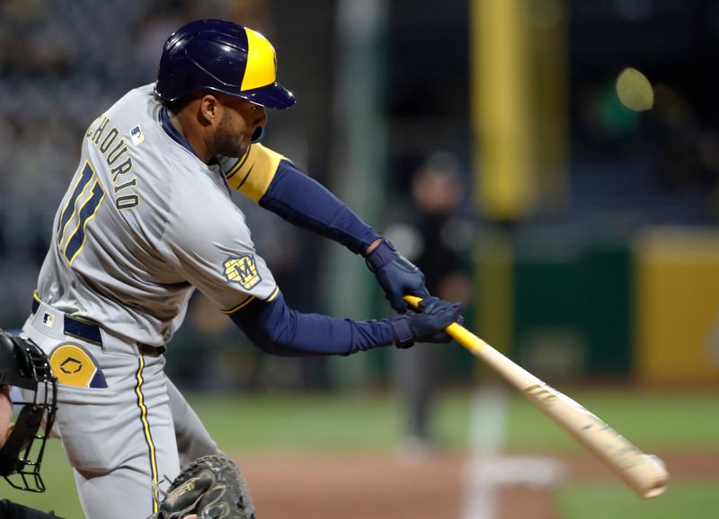 Apr 22, 2024; Pittsburgh, Pennsylvania, USA;  Milwaukee Brewers right fielder Jackson Chourio (11) hits a single against the Pittsburgh Pirates during the ninth inning at PNC Park. Pittsburgh won 4-2. Mandatory Credit: Charles LeClaire-USA TODAY Sports