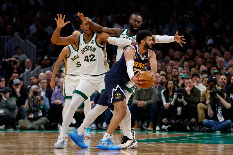 BOSTON, MA - JANUARY 19: Jamal Murray #27 of the Denver Nuggets tries to find a way around Al Horford #42 of the Boston Celtics and Jaylen Brown #7 during the second half at TD Garden on January 19, 2024 in Boston, Massachusetts. NOTE TO USER: User expressly acknowledges and agrees that, by downloading and/or using this Photograph, user is consenting to the terms and conditions of the Getty Images License Agreement. (Photo By Winslow Townson/Getty Images)