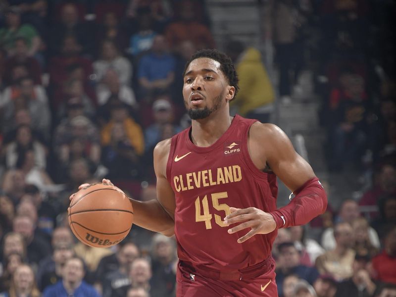 CLEVELAND, OH - FEBRUARY 27: Donovan Mitchell #45 of the Cleveland Cavaliers dribbles the ball during the game against the Dallas Mavericks on February 27, 2024 at Rocket Mortgage FieldHouse in Cleveland, Ohio. NOTE TO USER: User expressly acknowledges and agrees that, by downloading and/or using this Photograph, user is consenting to the terms and conditions of the Getty Images License Agreement. Mandatory Copyright Notice: Copyright 2024 NBAE (Photo by David Liam Kyle/NBAE via Getty Images)