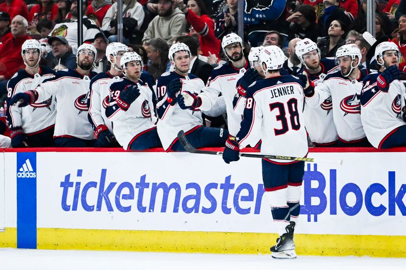 Mar 2, 2024; Chicago, Illinois, USA;  Columbus Blue Jackets center Boone Jenner (38) celebrates his goal against the Chicago Blackhawks with teammates during the first period at the  United Center. Mandatory Credit: Matt Marton-USA TODAY Sports