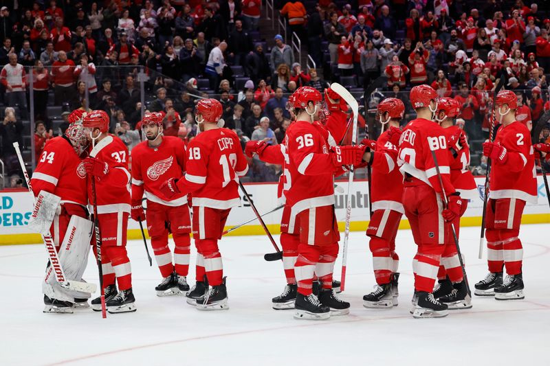 Jan 25, 2024; Detroit, Michigan, USA;  Detroit Red Wings celebrate after defeating the Philadelphia Flyers at Little Caesars Arena. Mandatory Credit: Rick Osentoski-USA TODAY Sports