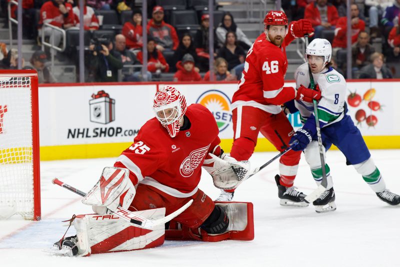 Dec 1, 2024; Detroit, Michigan, USA;  Detroit Red Wings goaltender Ville Husso (35) makes a save in the third period against the Vancouver Canucks at Little Caesars Arena. Mandatory Credit: Rick Osentoski-Imagn Images