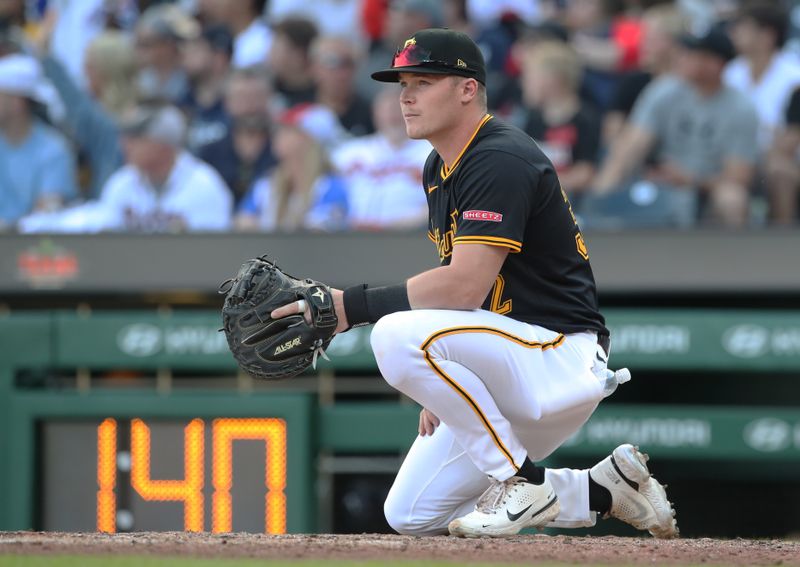 May 10, 2025; Pittsburgh, Pennsylvania, USA; Pittsburgh Pirates catcher Henry Davis (32) warms up a relief pitcher  against the Atlanta Braves before the seventh inning at PNC Park. Mandatory Credit: Charles LeClaire-Imagn Images