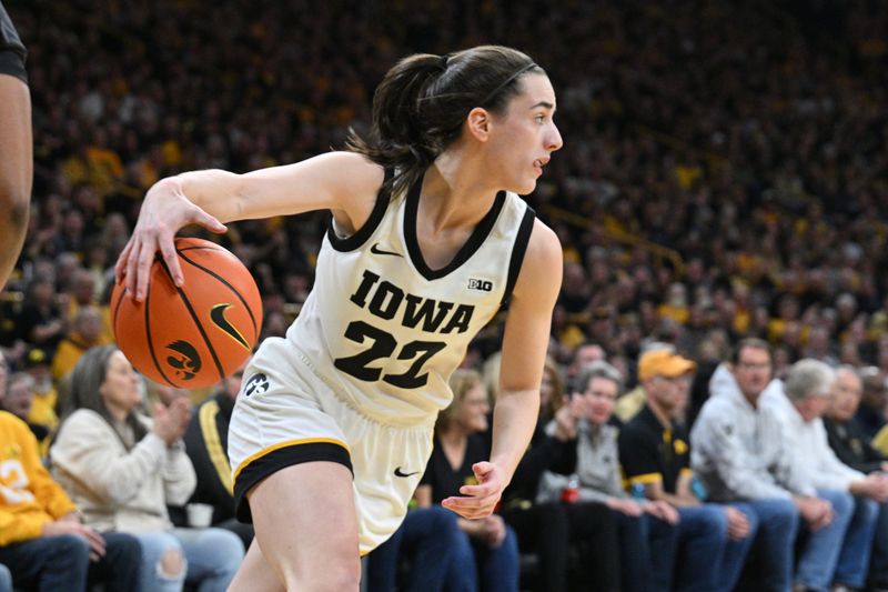 Mar 3, 2024; Iowa City, Iowa, USA; Iowa Hawkeyes guard Caitlin Clark (22) controls the ball during the first quarter against the Ohio State Buckeyes at Carver-Hawkeye Arena. Mandatory Credit: Jeffrey Becker-USA TODAY Sports