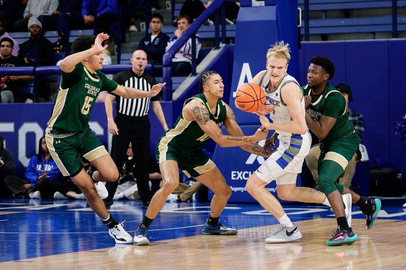 Mar 9, 2024; Colorado Springs, Colorado, USA; Air Force Falcons forward Rytis Petraitis (31) is fouled by Colorado State Rams guard Nique Clifford (10) as guard Jalen Lake (15) and guard Isaiah Stevens (4) defend in the first half at Clune Arena. Mandatory Credit: Isaiah J. Downing-USA TODAY Sports