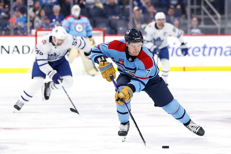 Jan 27, 2024; Winnipeg, Manitoba, CAN; Winnipeg Jets center Vladislav Namestnikov (7) skates through the neutral zone in the second period against the Toronto Maple Leafs at Canada Life Centre. Mandatory Credit: James Carey Lauder-USA TODAY Sports