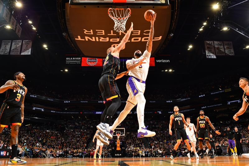 PHOENIX, AZ - NOVEMBER 26: Anthony Davis #3 of the Los Angeles Lakers drives to the basket during the game against the Phoenix Suns during the Emirates NBA Cup game on November 26, 2024 at Footprint Center in Phoenix, Arizona. NOTE TO USER: User expressly acknowledges and agrees that, by downloading and or using this photograph, user is consenting to the terms and conditions of the Getty Images License Agreement. Mandatory Copyright Notice: Copyright 2024 NBAE (Photo by Barry Gossage/NBAE via Getty Images)