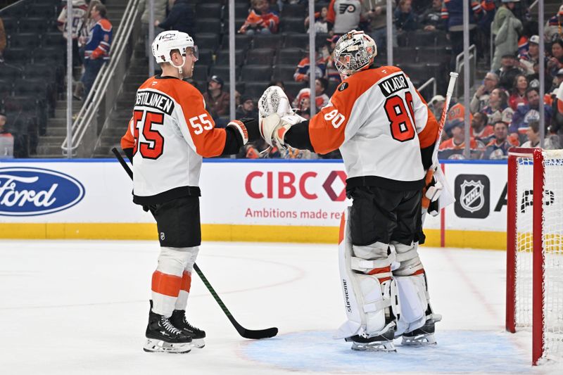 Jan 3, 2026; Edmonton, Alberta, CAN;   Philadelphia Flyers defenseman Rasmus Ristolainen (55) and goalie Dan Vladar (80) celebrate their win over the Edmonton Oilers during the third period at Rogers Place. Mandatory Credit: Walter Tychnowicz-Imagn Images