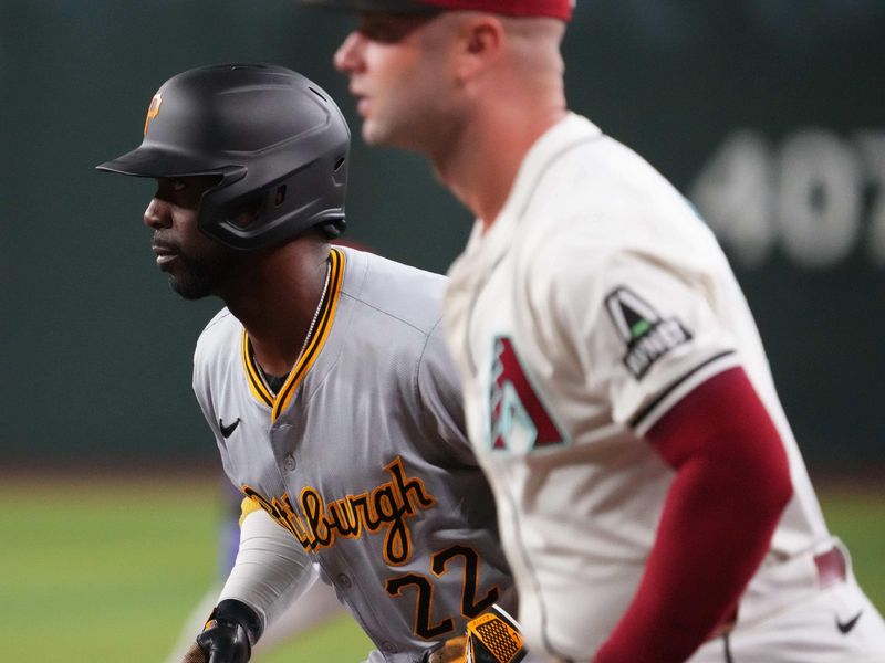 Jul 26, 2024; Phoenix, Arizona, USA; Pittsburgh Pirates outfielder Andrew McCutchen (22) leads off first base as Arizona Diamondbacks first base Christian Walker (53) covers the bag during the first inning at Chase Field. Mandatory Credit: Joe Camporeale-USA TODAY Sports