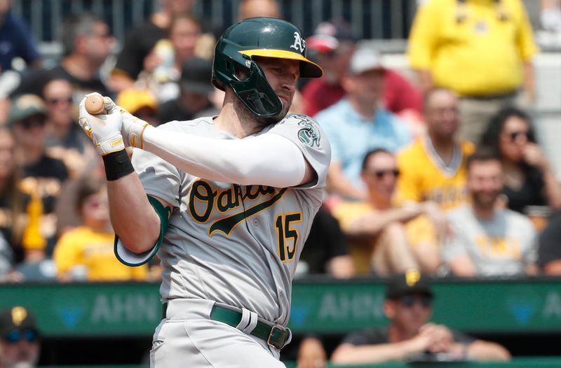 Jun 7, 2023; Pittsburgh, Pennsylvania, USA;  Oakland Athletics left fielder Seth Brown (15) hits a single against the Pittsburgh Pirates during the fifth inning at PNC Park. Mandatory Credit: Charles LeClaire-USA TODAY Sports