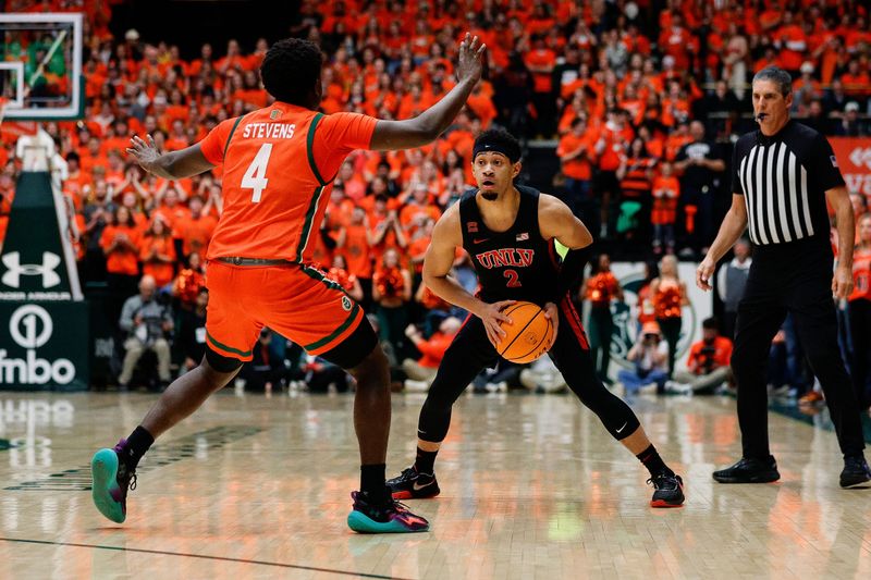 Jan 19, 2024; Fort Collins, Colorado, USA; UNLV Rebels guard Justin Webster (2) controls the ball as Colorado State Rams guard Isaiah Stevens (4) guards in the first half at Moby Arena. Mandatory Credit: Isaiah J. Downing-USA TODAY Sports