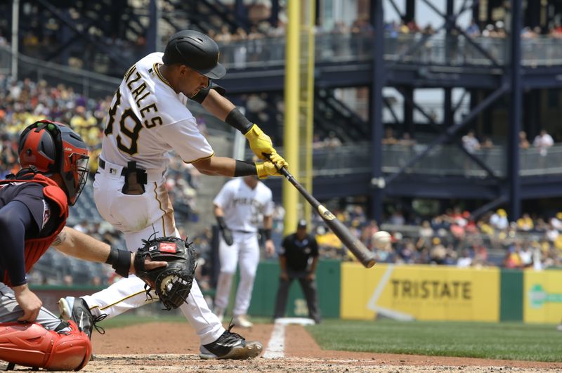 Jul 19, 2023; Pittsburgh, Pennsylvania, USA;  Pittsburgh Pirates second baseman Nick Gonzales (39) hits an RBI single against the Cleveland Guardians during the fifth inning at PNC Park. Mandatory Credit: Charles LeClaire-USA TODAY Sports