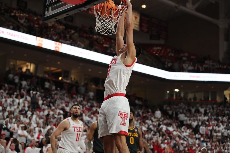 Jan 17, 2023; Lubbock, Texas, USA;  Texas Tech Red Raiders forward Daniel Batcho (12) dunks the ball against the Baylor Bears in the second half at United Supermarkets Arena. Mandatory Credit: Michael C. Johnson-USA TODAY Sports