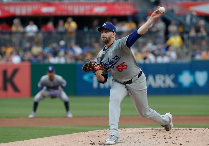 Jun 5, 2024; Pittsburgh, Pennsylvania, USA;  Los Angeles Dodgers starting pitcher James Paxton (65) delivers a pitch against the Pittsburgh Pirates during the first inning at PNC Park. Mandatory Credit: Charles LeClaire-USA TODAY Sports